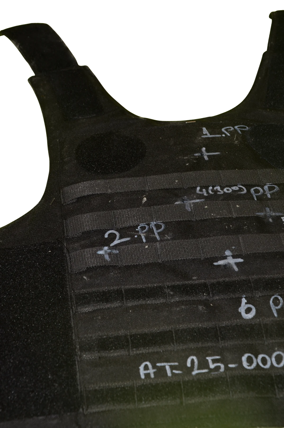 Close-up of rounds embedded in the ballistic weave, stopped before exiting the panel.